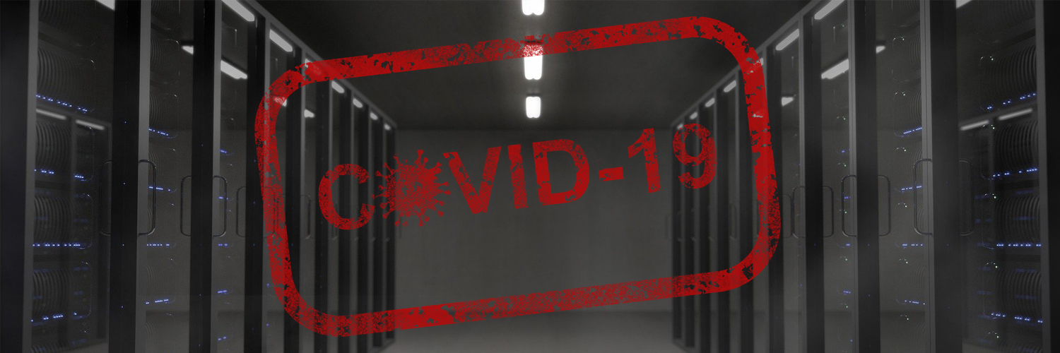 Dark server room with red covid-19 badge